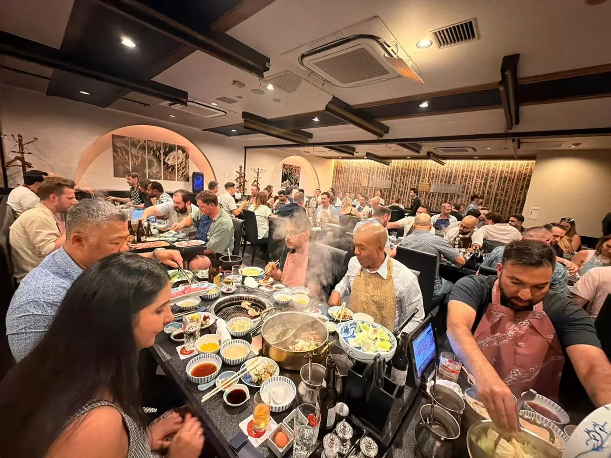 Dinner for the whole group, hot pots steaming on every table